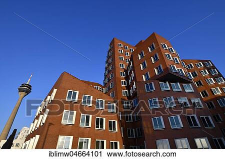 Stock Image - Rhine Tower with Gehry buildings, Neuer Zollhof, Media Harbour, Düsseldorf, North Rhine-Westphalia, Germany, Europe. Fotosearch
