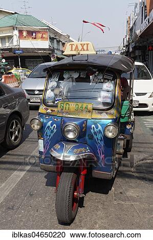 Rickshaw, Tuk Tuk Taxi in road traffic, Bangkok, Thailand, Asia View Large Photo Image Stock Image - Rickshaw, Tuk Tuk Taxi in road traffic, Bangkok, Thailand, Asia. Fotosearch