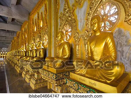 Row of golden Buddha statues in the corridor of the Phra Maha Chedi Chai Mongkhon Pagoda, Wat Pha Nam Yoi Temple, Phuttha-Utthayan Park, Province Roi Et, Isan, Northeast, Thailand, Asia View Large Photo Image Stock Photo - Row of golden Buddha statues in the corridor of the Phra Maha Chedi Chai Mongkhon Pagoda, Wat Pha Nam Yoi Temple, Phuttha-Utthayan Park, Province Roi Et, Isan, Northeast, Thailand, Asia. Fotosearch