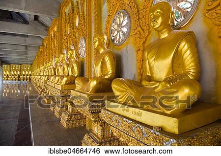 Row of golden Buddha statues in the corridor of the Phra Maha Chedi Chai Mongkhon Pagoda, Wat Pha Nam Yoi Temple, Phuttha-Utthayan Park, Province Roi Et, Isan, Northeast, Thailand, Asia View Large Photo Image Stock Photograph - Row of golden Buddha statues in the corridor of the Phra Maha Chedi Chai Mongkhon Pagoda, Wat Pha Nam Yoi Temple, Phuttha-Utthayan Park, Province Roi Et, Isan, Northeast, Thailand, Asia. Fotosearch