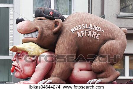 Picture - Russian bear rapes US President Donald Trump, political cartoon about russian affair, motto caravan Carnival Monday procession 2018, Düsseldorf, North Rhine-Westphalia, Germany, Europe. Fotosearch
