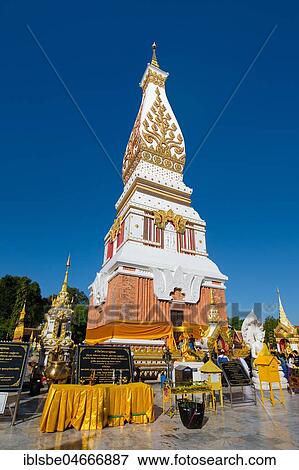 Sacrificial site in front of the Chedi of Wat Phra That Phanom, temple complex in Amphoe That Phanom, Nakhon Phanom Province, Isan, Thailand, Asia View Large Photo Image Stock Photo - Sacrificial site in front of the Chedi of Wat Phra That Phanom, temple complex in Amphoe That Phanom, Nakhon Phanom Province, Isan, Thailand, Asia. Fotosearch