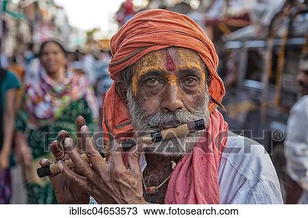 Sadhu plays flute at hinduistic festival Kumbh Mela, portrait, Ujjain, India, Asia View Large Photo Image Stock Image - Sadhu plays flute at hinduistic festival Kumbh Mela, portrait, Ujjain, India, Asia. Fotosearch