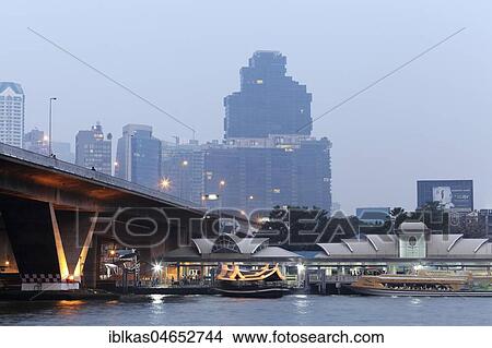 Saphan Taksin Bridge and Sathon Central Pier at the Mae Nam Chao Phraya River, Twilight, Sathon, Bangkok, Thailand, Asia View Large Photo Image Picture - Saphan Taksin Bridge and Sathon Central Pier at the Mae Nam Chao Phraya River, Twilight, Sathon, Bangkok, Thailand, Asia. Fotosearch