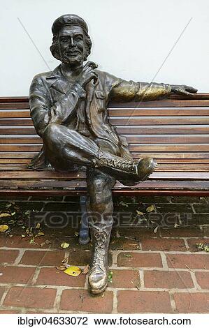 Stock Image - Sculpture of Ernesto Che Guevara sitting on a park bench, Museo Casa del Che, Alta Gracia, province of Córdoba, Argentina, South America. Fotosearch