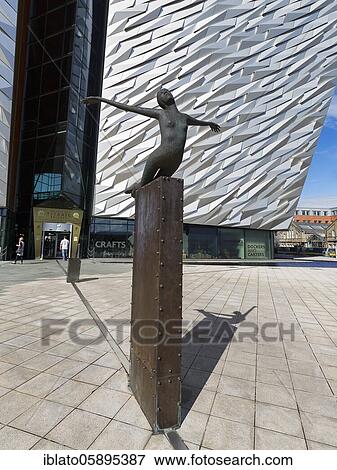 Sculpture Titanica, bronze female figure spreading her arms, sculptor Rowan Gillespie, Titanic Belfast Visitor Centre and Museum, Titanic Quarter, Belfast, Northern Ireland, Great Britain View Large Photo Image Stock Photo - Sculpture Titanica, bronze female figure spreading her arms, sculptor Rowan Gillespie, Titanic Belfast Visitor Centre and Museum, Titanic Quarter, Belfast, Northern Ireland, Great Britain. Fotosearch