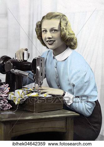 Seamstress, woman at sewing machine, 1930s, Germany, Europe View Large Photo Image Stock Photo - Seamstress, woman at sewing machine, 1930s, Germany, Europe. Fotosearch