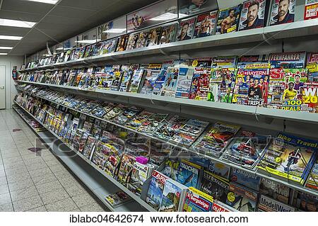 Shelf with magazines in a supermarket, Germany, Europe View Large Photo Image Picture - Shelf with magazines in a supermarket, Germany, Europe. Fotosearch