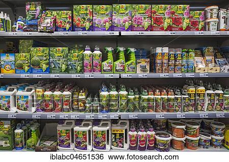 Stock Photograph - Shelf with pesticides and fertilizer, garden centre, interior, Bavaria, Germany, Europe. Fotosearch
