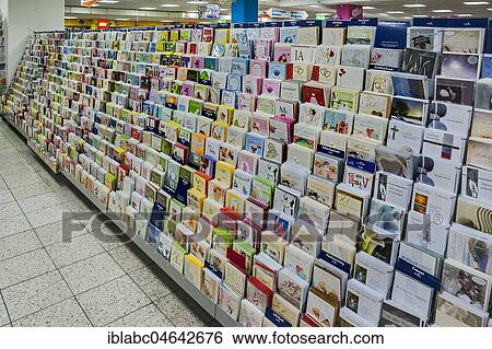 Shelf with postcards in a supermarket, Germany, Europe View Large Photo Image Stock Photograph - Shelf with postcards in a supermarket, Germany, Europe. Fotosearch