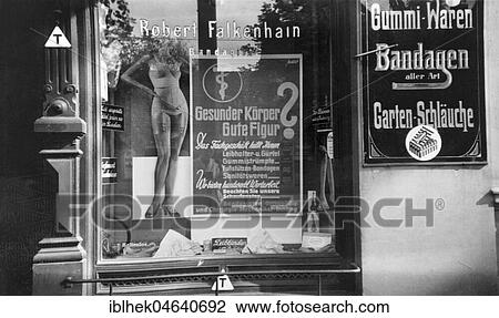 Stock Image - Shop window of a drugstore, underwear for a good figure, fashion, ca. 1940, exact location unknown, Germany, Europe. Fotosearch
