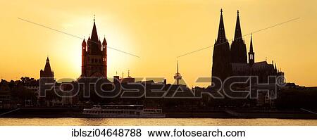 Silhouette of Groß Sankt Martin church with Cologne Cathedral and Rhine at sunset, Cologne, Rhineland, North Rhine-Westphalia, Germany, Europe View Large Photo Image Stock Photo - Silhouette of Groß Sankt Martin church with Cologne Cathedral and Rhine at sunset, Cologne, Rhineland, North Rhine-Westphalia, Germany, Europe. Fotosearch