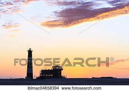 Silhouettes, Lighthouse and Lodge at sunset, Pelican Point, Walvis Bay, Erongo region, Namibia, Africa View Large Photo Image Picture - Silhouettes, Lighthouse and Lodge at sunset, Pelican Point, Walvis Bay, Erongo region, Namibia, Africa. Fotosearch