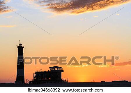Silhouettes, Lighthouse and Lodge at sunset, Pelican Point, Walvis Bay, Erongo region, Namibia, Africa View Large Photo Image Stock Image - Silhouettes, Lighthouse and Lodge at sunset, Pelican Point, Walvis Bay, Erongo region, Namibia, Africa. Fotosearch