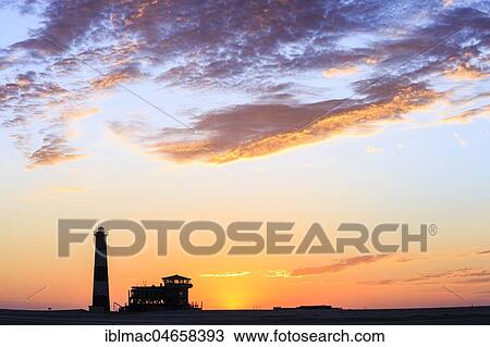 Silhouettes, Lighthouse and Lodge at sunset, Pelican Point, Walvis Bay, Erongo region, Namibia, Africa View Large Photo Image Stock Image - Silhouettes, Lighthouse and Lodge at sunset, Pelican Point, Walvis Bay, Erongo region, Namibia, Africa. Fotosearch