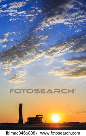 Silhouettes, Lighthouse and Lodge at sunset, Pelican Point, Walvis Bay, Erongo region, Namibia, Africa View Large Photo Image Stock Photo - Silhouettes, Lighthouse and Lodge at sunset, Pelican Point, Walvis Bay, Erongo region, Namibia, Africa. Fotosearch