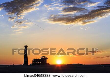 Silhouettes, Lighthouse and Lodge at sunset, Pelican Point, Walvis Bay, Erongo region, Namibia, Africa View Large Photo Image Stock Photo - Silhouettes, Lighthouse and Lodge at sunset, Pelican Point, Walvis Bay, Erongo region, Namibia, Africa. Fotosearch