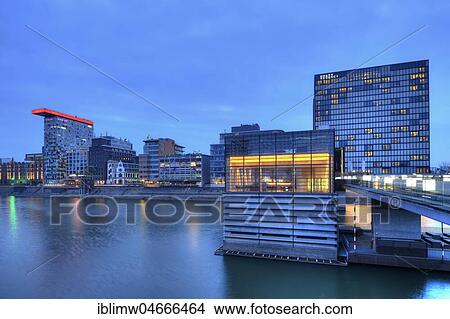 Skyline at Media Harbour, Lido, Colorium building with Innside Hotel, Roggendorf-Haus, Hyatt Rgency Hotel, blue hour, Düsseldorf, North Rhine-Westphalia, Germany, Europe View Large Photo Image Picture - Skyline at Media Harbour, Lido, Colorium building with Innside Hotel, Roggendorf-Haus, Hyatt Rgency Hotel, blue hour, Düsseldorf, North Rhine-Westphalia, Germany, Europe. Fotosearch