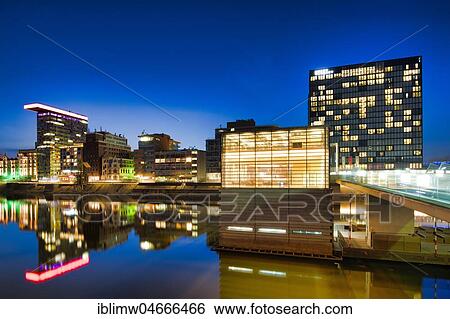 Stock Photograph - Skyline at Media Harbour, Lido, Colorium building with Innside Hotel, Roggendorf-Haus, Hyatt Rgency Hotel, blue hour, Düsseldorf, North Rhine-Westphalia, Germany, Europe. Fotosearch