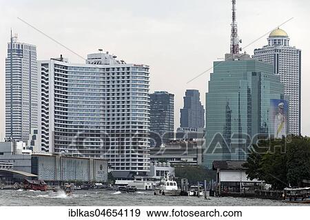 Stock Photo - Skyline on the Mae Nam Chao Phraya River, Sheraton Hotel, CAT Telecom Tower, Lebua State Tower, Bang Rak Financial District, Bangkok, Thailand, Asia. Fotosearch