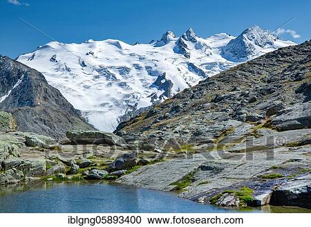 Small mountain lake on Fuorcla Surlej with Piz Glüschaint, Silvaplana, Bernina Alps, Upper Engadine, Engadine, Grisons, Switzerland, Europe View Large Photo Image Stock Image - Small mountain lake on Fuorcla Surlej with Piz Glüschaint, Silvaplana, Bernina Alps, Upper Engadine, Engadine, Grisons, Switzerland, Europe. Fotosearch