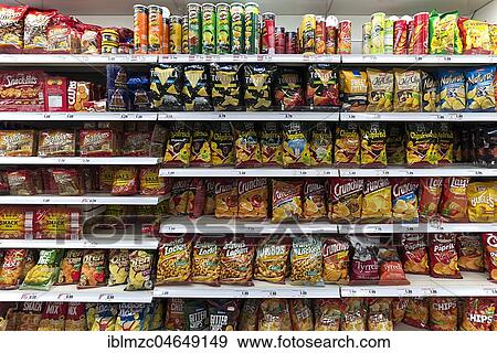 Snacks and chips in a supermarket shelf, Germany, Europe View Large Photo Image Stock Photo - Snacks and chips in a supermarket shelf, Germany, Europe. Fotosearch