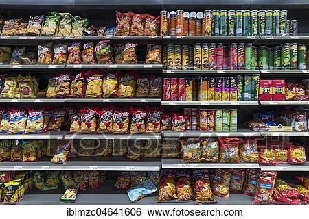 Snacks in a supermarket shelf, Germany, Europe View Large Photo Image Stock Photograph - Snacks in a supermarket shelf, Germany, Europe. Fotosearch