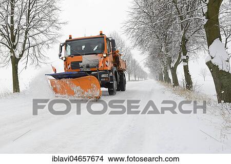 Picture - Snow plough on snowy avenue in winter, winter services, Burgenlandkreis, Saxony-Anhalt, Germany, Europe. Fotosearch