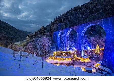 Snowy Christmas market under a railway viaduct, illuminated, Ravennaschlucht, Höllental near Freiburg im Breisgau, Black Forest, Baden-Württemberg, Germany, Europe View Large Photo Image Picture - Snowy Christmas market under a railway viaduct, illuminated, Ravennaschlucht, Höllental near Freiburg im Breisgau, Black Forest, Baden-Württemberg, Germany, Europe. Fotosearch