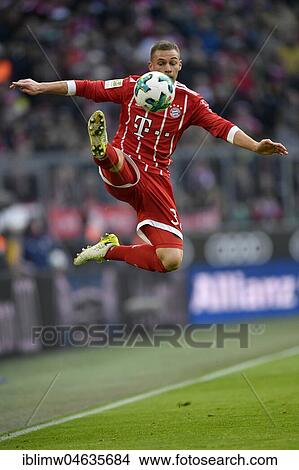 Picture - Soccer player Joshua Kimmich from FC Bayern Munich artistically on the ball, Allianz Arena, Munich, Bavaria, Germany, Europe. Fotosearch