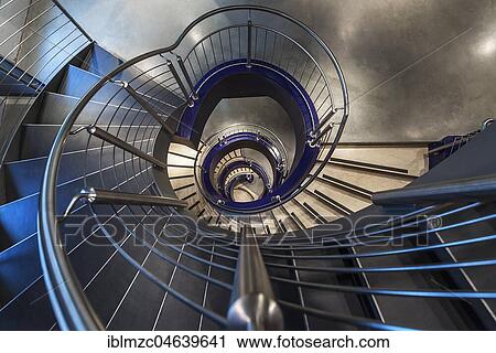 Stock Image - Spiral staircase in a department store, Nuremberg, Middle Franconia, Bavaria, Germany, Europe. Fotosearch