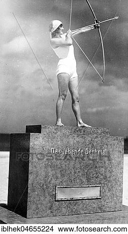 Picture - Sport, Archery, Woman as living monument, 1930s, exact place unknown, Germany, Europe. Fotosearch