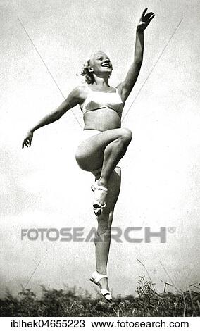 Sport, woman doing gymnastics in a bikini, 1940s, exact place unknown, Germany, Europe View Large Photo Image Stock Image - Sport, woman doing gymnastics in a bikini, 1940s, exact place unknown, Germany, Europe. Fotosearch