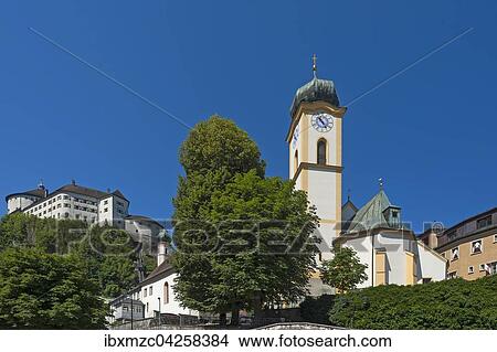 Stadtpfarrkirche St. Vitus, hinten Festung Kufstein, Kufstein, Tirol, Osterreich, Europa View Large Photo Image Picture - Stadtpfarrkirche St. Vitus, hinten Festung Kufstein, Kufstein, Tirol, Osterreich, Europa. Fotosearch