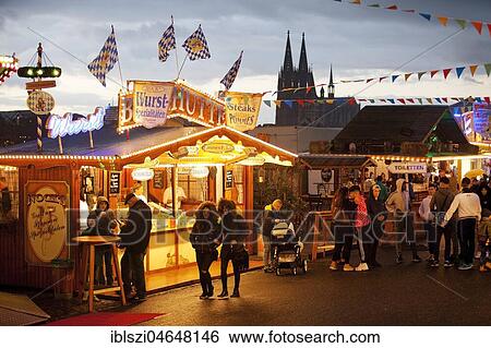 Stands at Deutz funfair with Cologne Cathedral, evening mood, Cologne, North Rhine-Westphalia, Germany, Europe View Large Photo Image Stock Photograph - Stands at Deutz funfair with Cologne Cathedral, evening mood, Cologne, North Rhine-Westphalia, Germany, Europe. Fotosearch