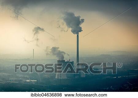 STEAG heating power plant Herne, coal power station with smoke cloud in the haze in front of industrial backdrop, Herne, Ruhr area, North Rhine-Westphalia, Germany, Europe View Large Photo Image Stock Photo - STEAG heating power plant Herne, coal power station with smoke cloud in the haze in front of industrial backdrop, Herne, Ruhr area, North Rhine-Westphalia, Germany, Europe. Fotosearch