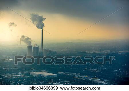 Stock Photo - STEAG heating power plant Herne, coal power station with smoke cloud in the haze in front of industrial backdrop, Herne, Ruhr area, North Rhine-Westphalia, Germany, Europe. Fotosearch