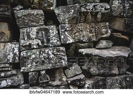 Stock Photo - Stones with stone relief at a temple ruin, detail, Angkor Archaeological Park, province Siem Reap, Cambodia, Asia. Fotosearch