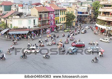 Stock Image - Street action at the Dinh Tien Hoang, Le Thai To and Hang Dao streets intersection, Hanoi, Vietnam, Asia. Fotosearch