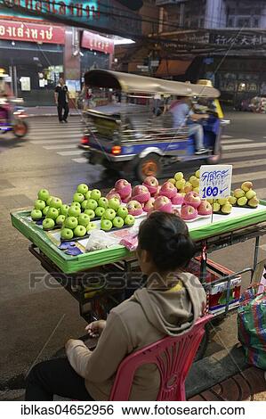 Street sale, fruit, on Yaowarat Road at night, stand with apples, Chinatown, Samphanthawong, Bangkok, Thailand, Asia View Large Photo Image Stock Photograph - Street sale, fruit, on Yaowarat Road at night, stand with apples, Chinatown, Samphanthawong, Bangkok, Thailand, Asia. Fotosearch