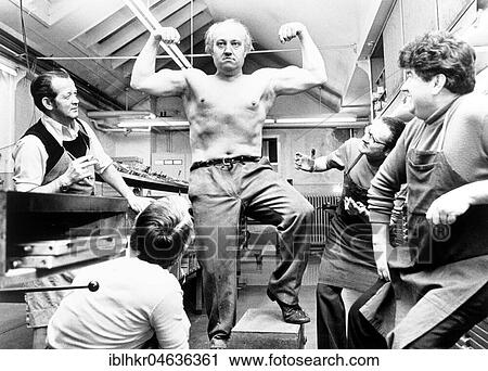 Strong man poses and shows his muscles, ca. 1970s, exact place unknown, Germany, Europe View Large Photo Image Stock Image - Strong man poses and shows his muscles, ca. 1970s, exact place unknown, Germany, Europe. Fotosearch