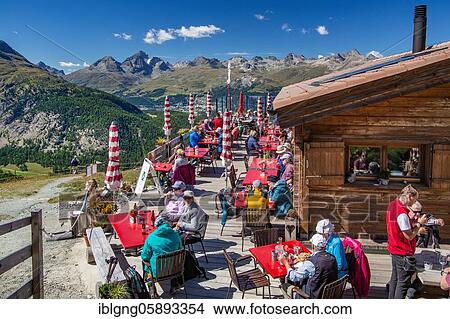 Picture - Sun terrace of the Alp Languard mountain inn above the Bernina Valley, Pontresina, Bernina Alps, Upper Engadine, Engadine, Grisons, Switzerland, Europe. Fotosearch