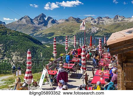 Stock Image - Sun terrace of the Alp Languard mountain inn above the Bernina Valley, Pontresina, Bernina Alps, Upper Engadine, Engadine, Grisons, Switzerland, Europe. Fotosearch