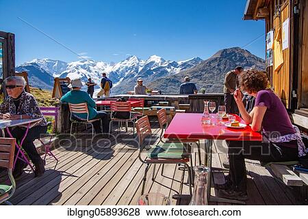 Stock Photo - Sun terrace of the Paradise Hut with Piz Palü, Bellavista and Piz Bernina above the Bernina Valley, Pontresina, Bernina Alps, Upper Engadine, Engadine, Grisons, Switzerland, Europe. Fotosearch