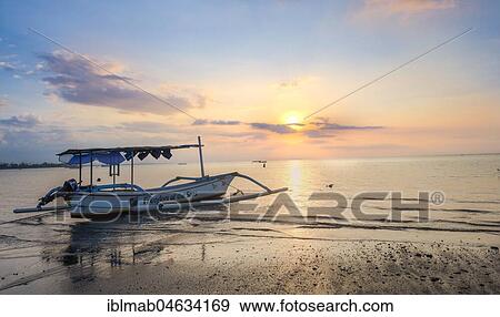 Sunset on the beach, outrigger canoe at the sea, Lovina Beach, Bali, Indonesia, Asia View Large Photo Image Stock Photo - Sunset on the beach, outrigger canoe at the sea, Lovina Beach, Bali, Indonesia, Asia. Fotosearch