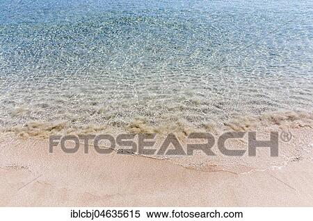 Stock Photography - Surf on a sandy beach, Puglia, Italy, Europe. Fotosearch