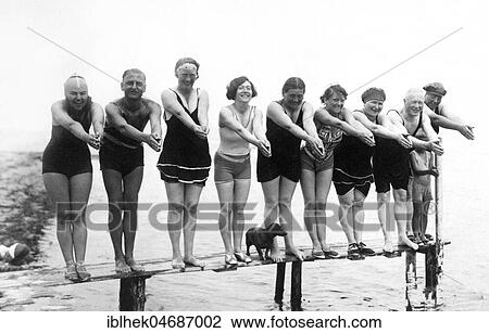 Swimwear, holidays, nine men and women and a dachshund posing on a jetty, 1920s, Usedom, Baltic Sea, Germany, Europe View Large Photo Image Stock Image - Swimwear, holidays, nine men and women and a dachshund posing on a jetty, 1920s, Usedom, Baltic Sea, Germany, Europe. Fotosearch