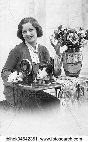 Stock Image - Tailor with sewing machine, 1910s, Germany, Europe. Fotosearch