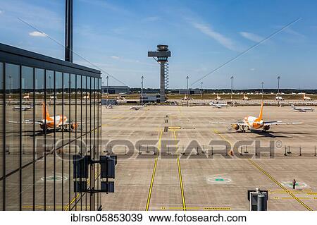 Tarmac with easyjet aircraft and the tower at the new Berlin airport BER, Schönefeld, Germany, Europe View Large Photo Image Stock Photo - Tarmac with easyjet aircraft and the tower at the new Berlin airport BER, Schönefeld, Germany, Europe. Fotosearch