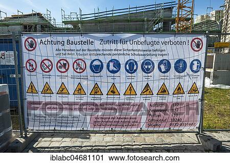 Stock Image - Tarpaulin with prohibitions and information at construction site, Munich, Upper Bavaria, Bavaria, Germany, Europe. Fotosearch